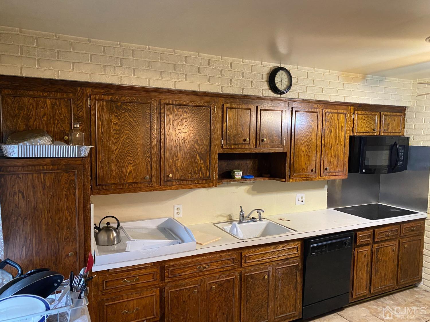 230 Austin Road Orange, NJ 07050 - Photo 15 of 34 a kitchen with stainless steel appliances granite countertop a sink and wooden cabinets