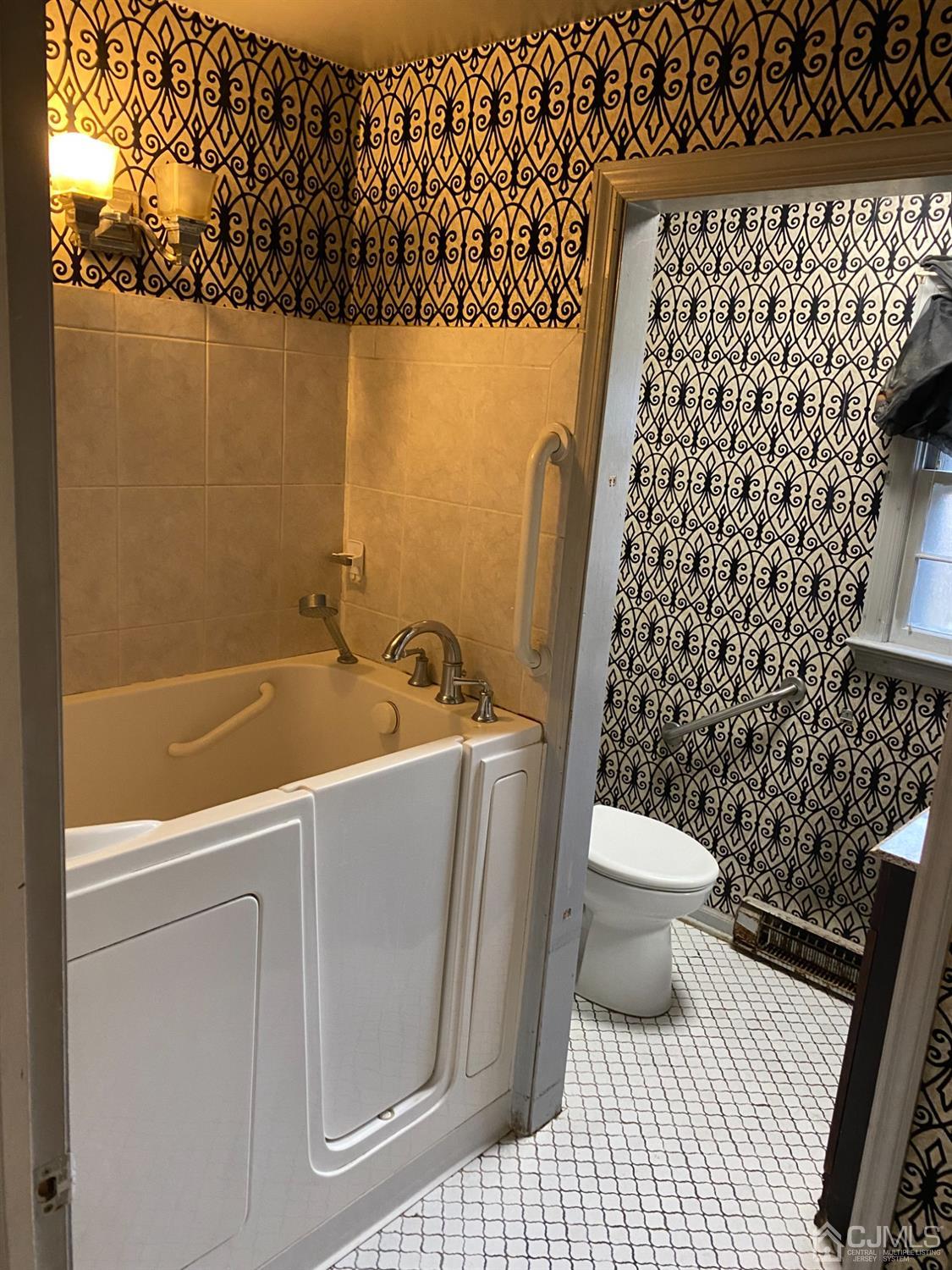 230 Austin Road Orange, NJ 07050 - Photo 16 of 34 a bathroom with a sink a toilet and a shower