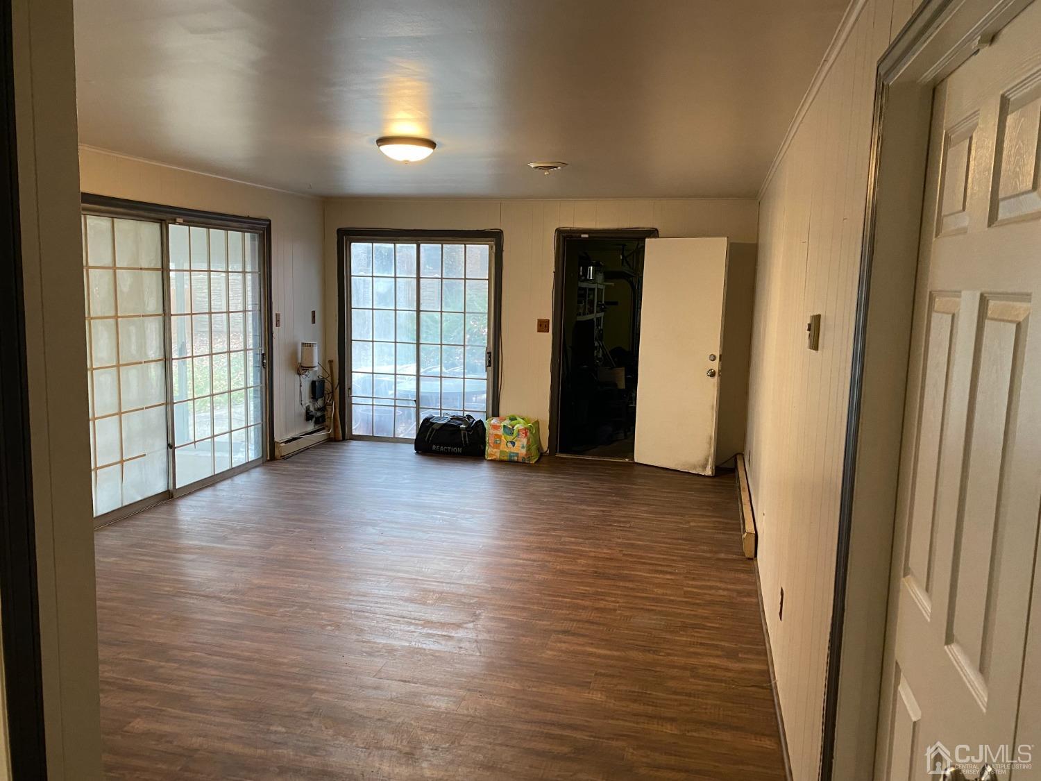 230 Austin Road Orange, NJ 07050 - Photo 17 of 34 an empty room with wooden floor and windows