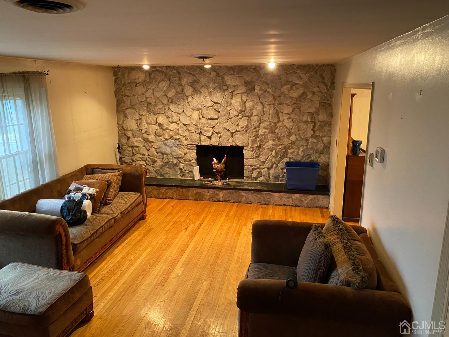 230 Austin Road Orange, NJ 07050 - Photo 19 of 34 a living room with furniture and a fireplace