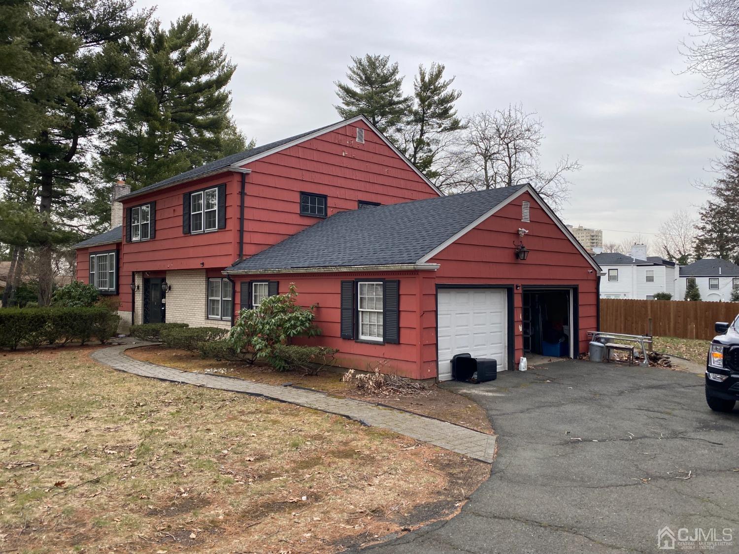 230 Austin Road Orange, NJ 07050 - Photo 2 of 34 a front view of a house with a yard