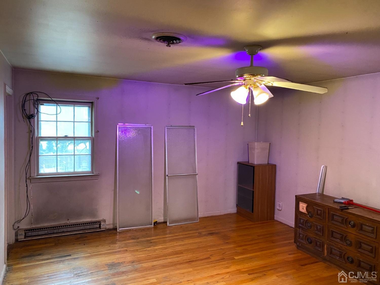 230 Austin Road Orange, NJ 07050 - Photo 22 of 34 a view of a livingroom with a chandelier fan