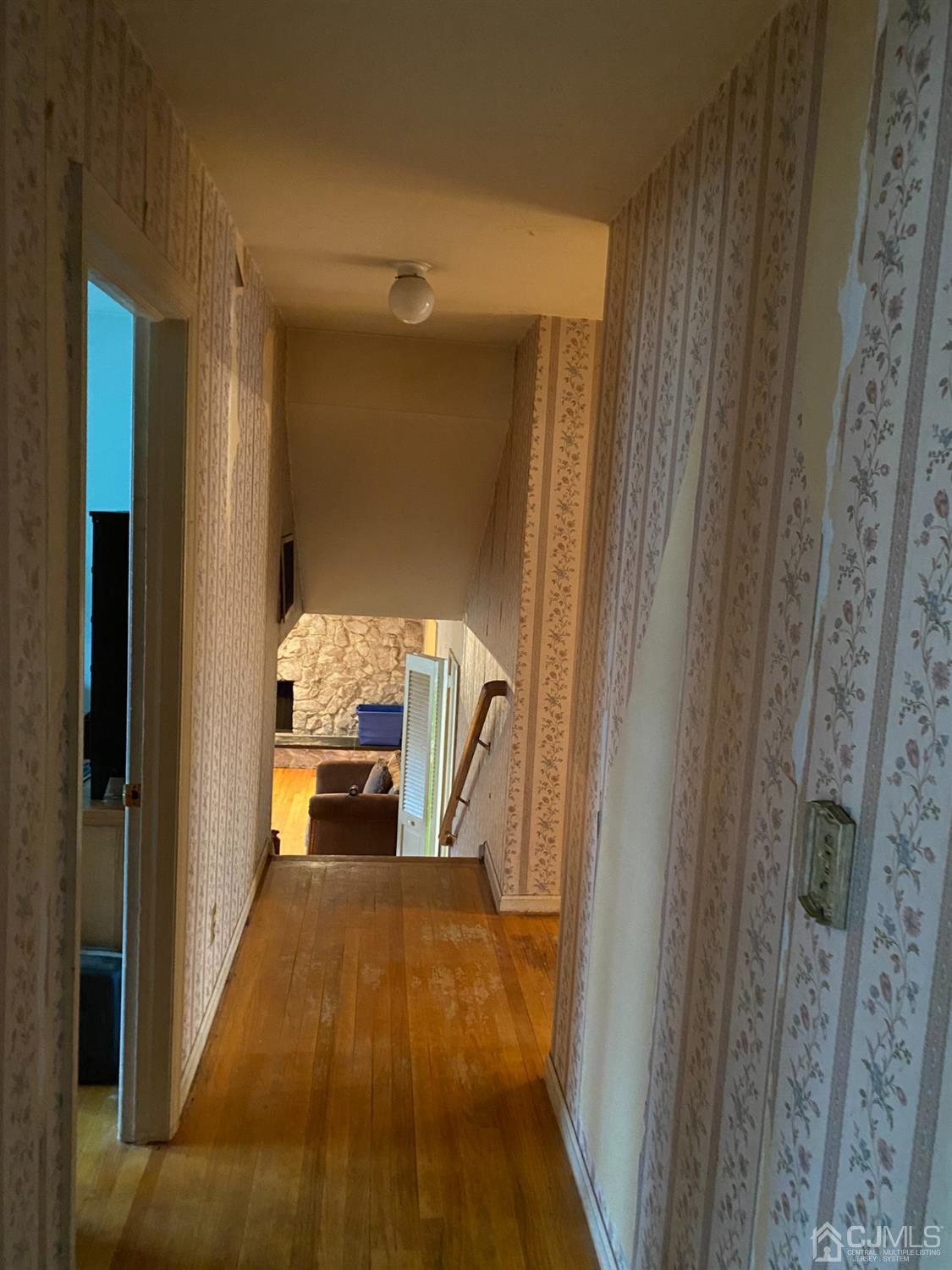 230 Austin Road Orange, NJ 07050 - Photo 24 of 34 a hallway with a wooden floor and furniture