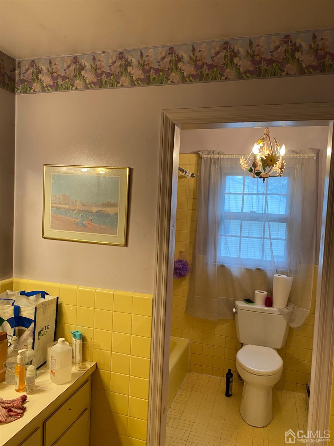 230 Austin Road Orange, NJ 07050 - Photo 26 of 34 a bathroom with a toilet sink and mirror