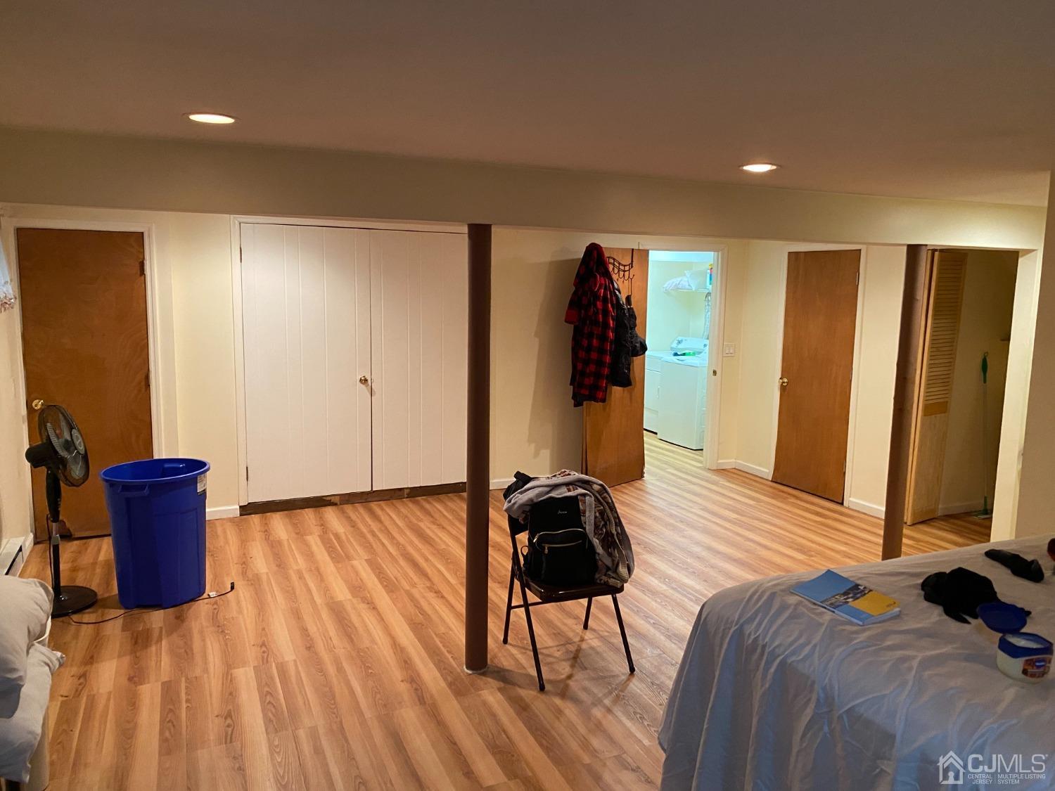 230 Austin Road Orange, NJ 07050 - Photo 29 of 34 a bedroom with a bed and wooden floor