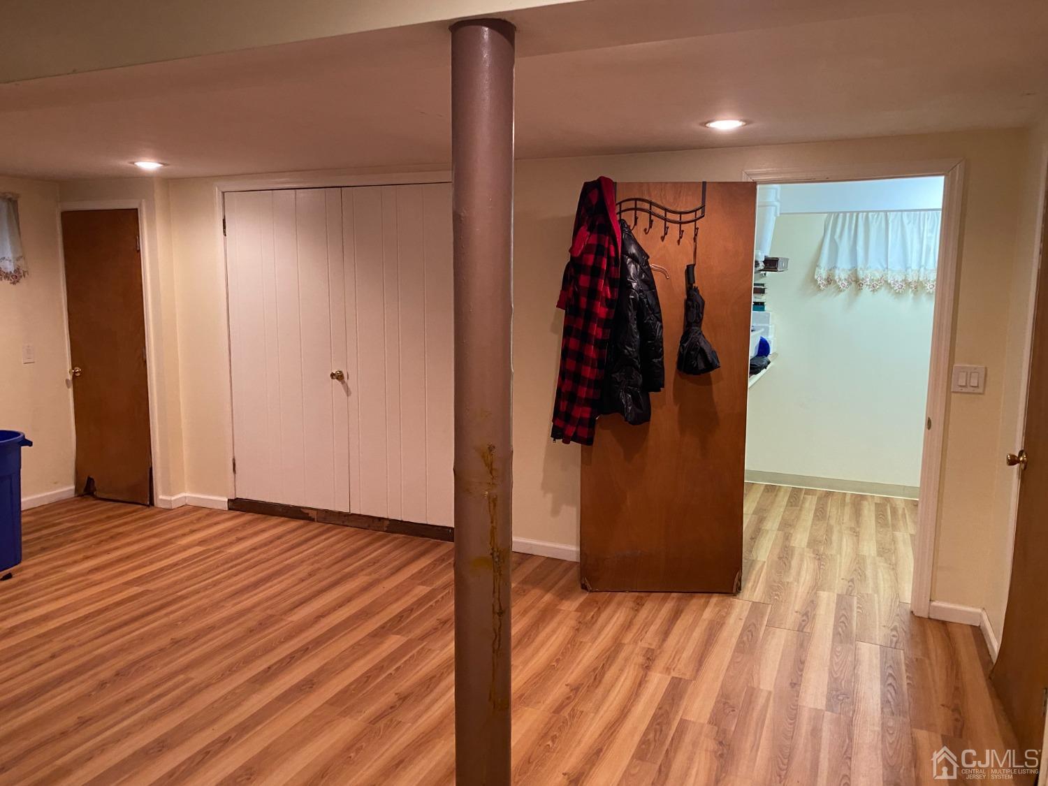 230 Austin Road Orange, NJ 07050 - Photo 30 of 34 a view of walk in closet with clothes and shoes
