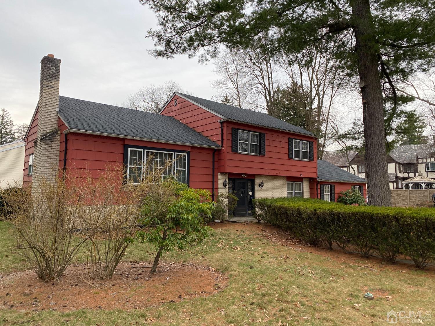 230 Austin Road Orange, NJ 07050 - Photo 3 of 34 a front view of a house with garden