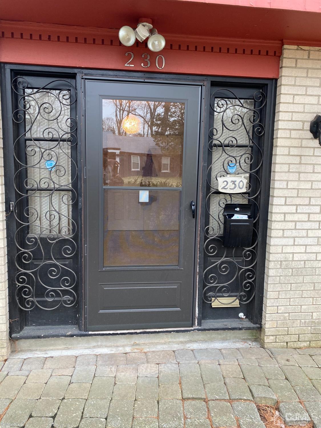 230 Austin Road Orange, NJ 07050 - Photo 6 of 34 a front view of a building with a glass door