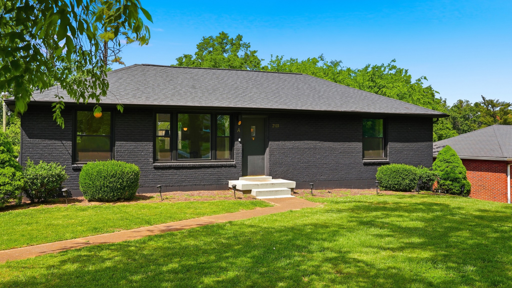2101 Porter Road Nashville, TN 37216 - Photo 2 of 48 a front view of a house with a yard