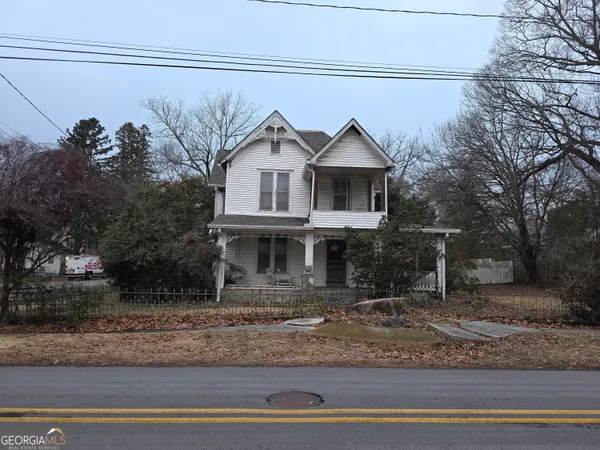 a view of a house with a street