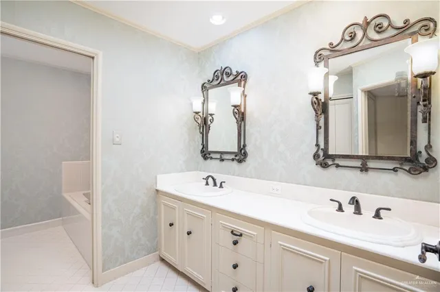 a bathroom with a double vanity sink and mirror