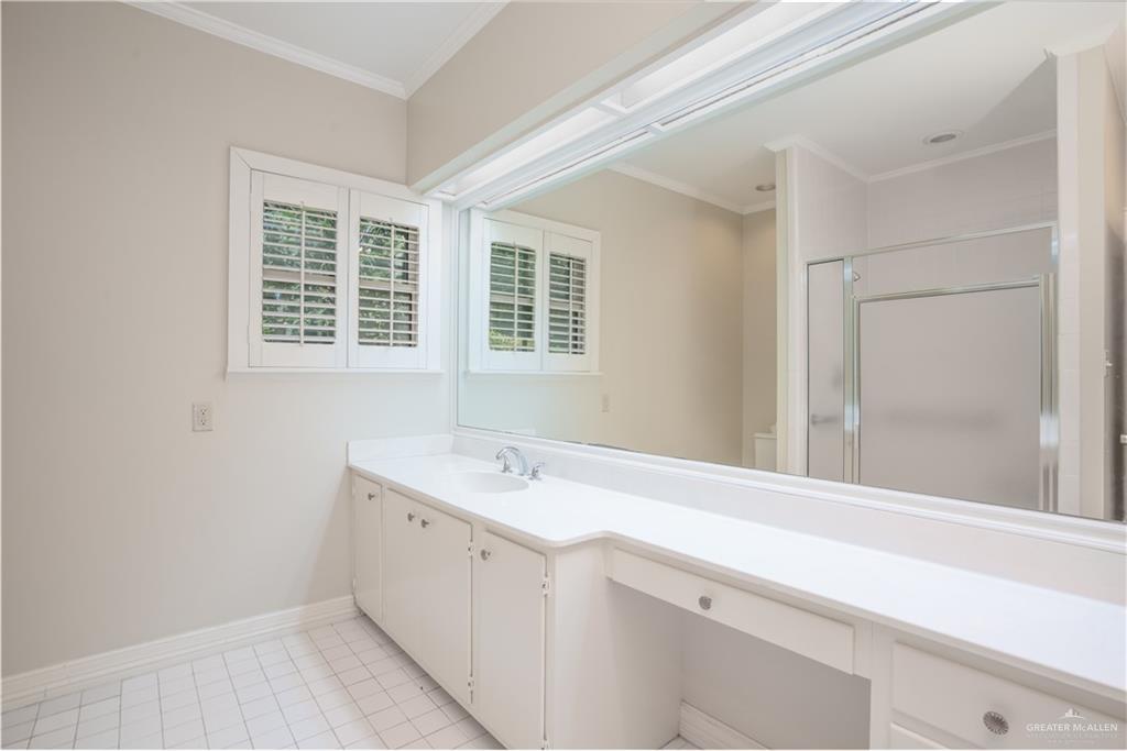 1131 West 6th Street Weslaco, TX 78596 - Photo 29 of 45 a bathroom with a sink and a mirror