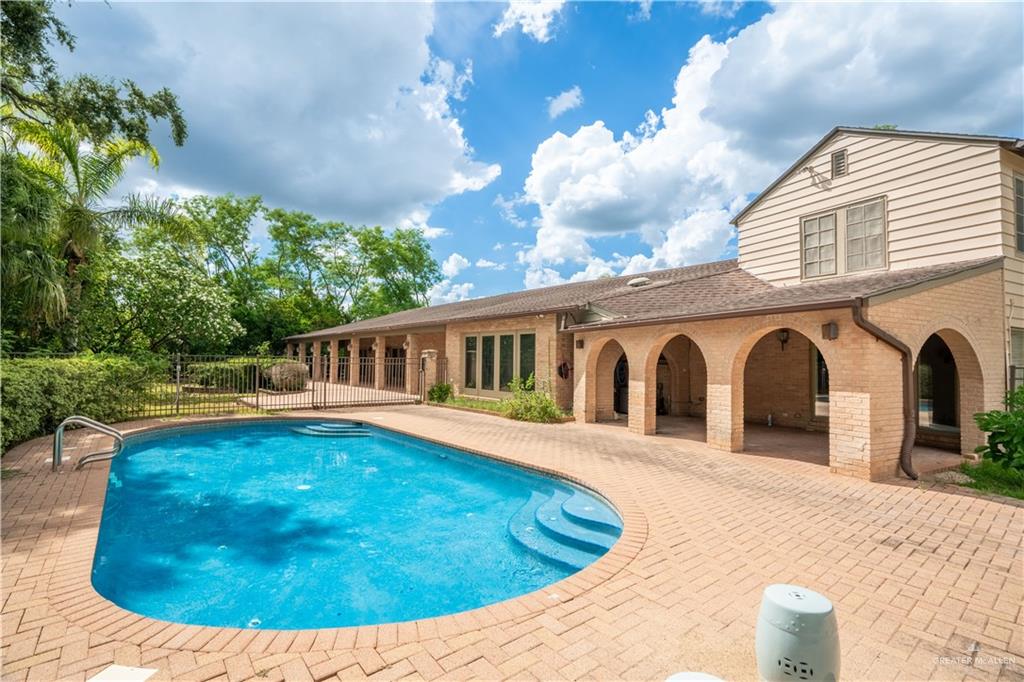 1131 West 6th Street Weslaco, TX 78596 - Photo 31 of 45 a view of a house with pool