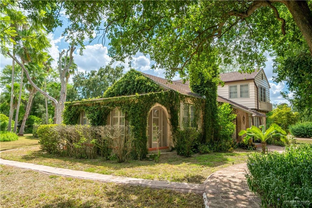 1131 West 6th Street Weslaco, TX 78596 - Photo 32 of 45 a view of a garden with plants and large trees