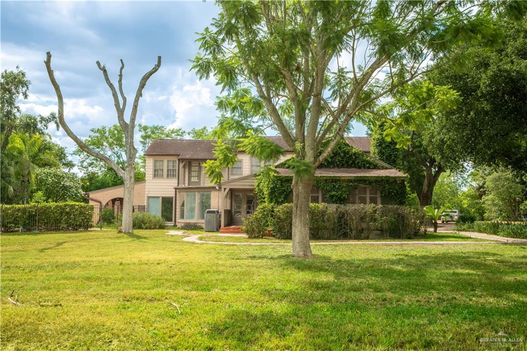 1131 West 6th Street Weslaco, TX 78596 - Photo 39 of 45 a front view of a house with a yard
