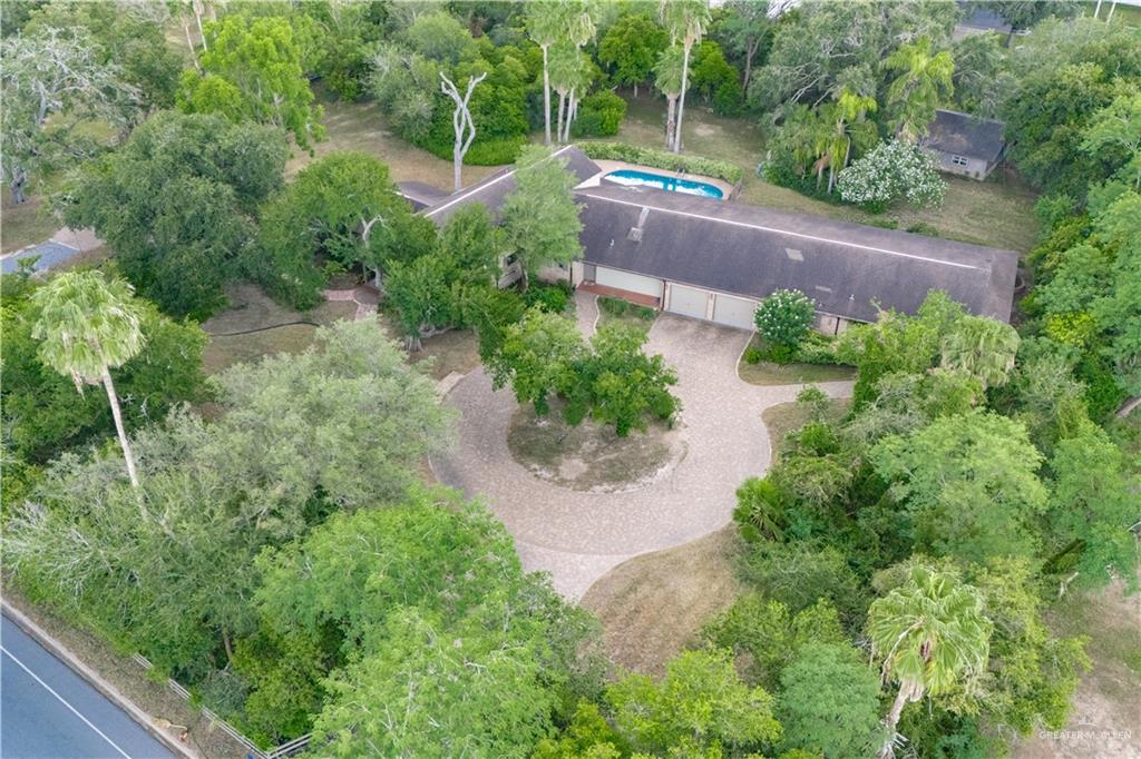 1131 West 6th Street Weslaco, TX 78596 - Photo 42 of 45 an aerial view of a house with garden space and a street view