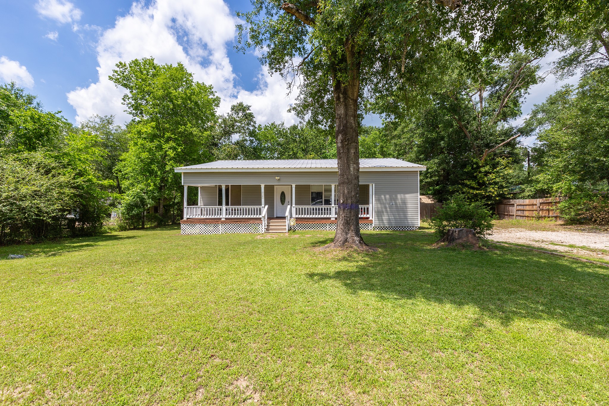 240 North 7th Street Trinity, TX 75862 - Photo 2 of 32 a view of a house with a backyard