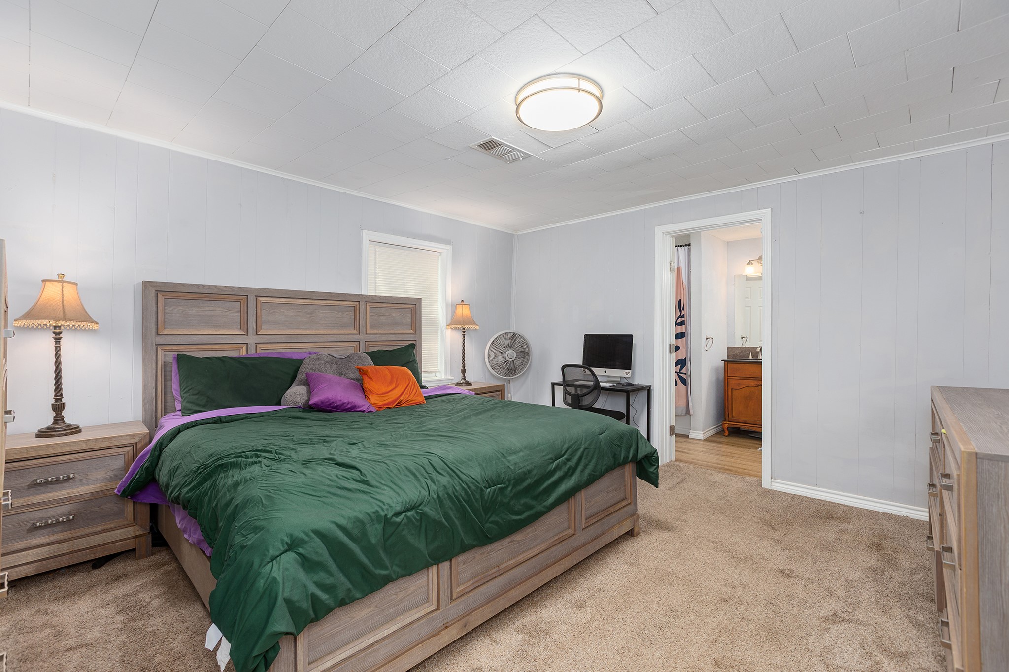 240 North 7th Street Trinity, TX 75862 - Photo 23 of 32 a bedroom with a bed and a lamp