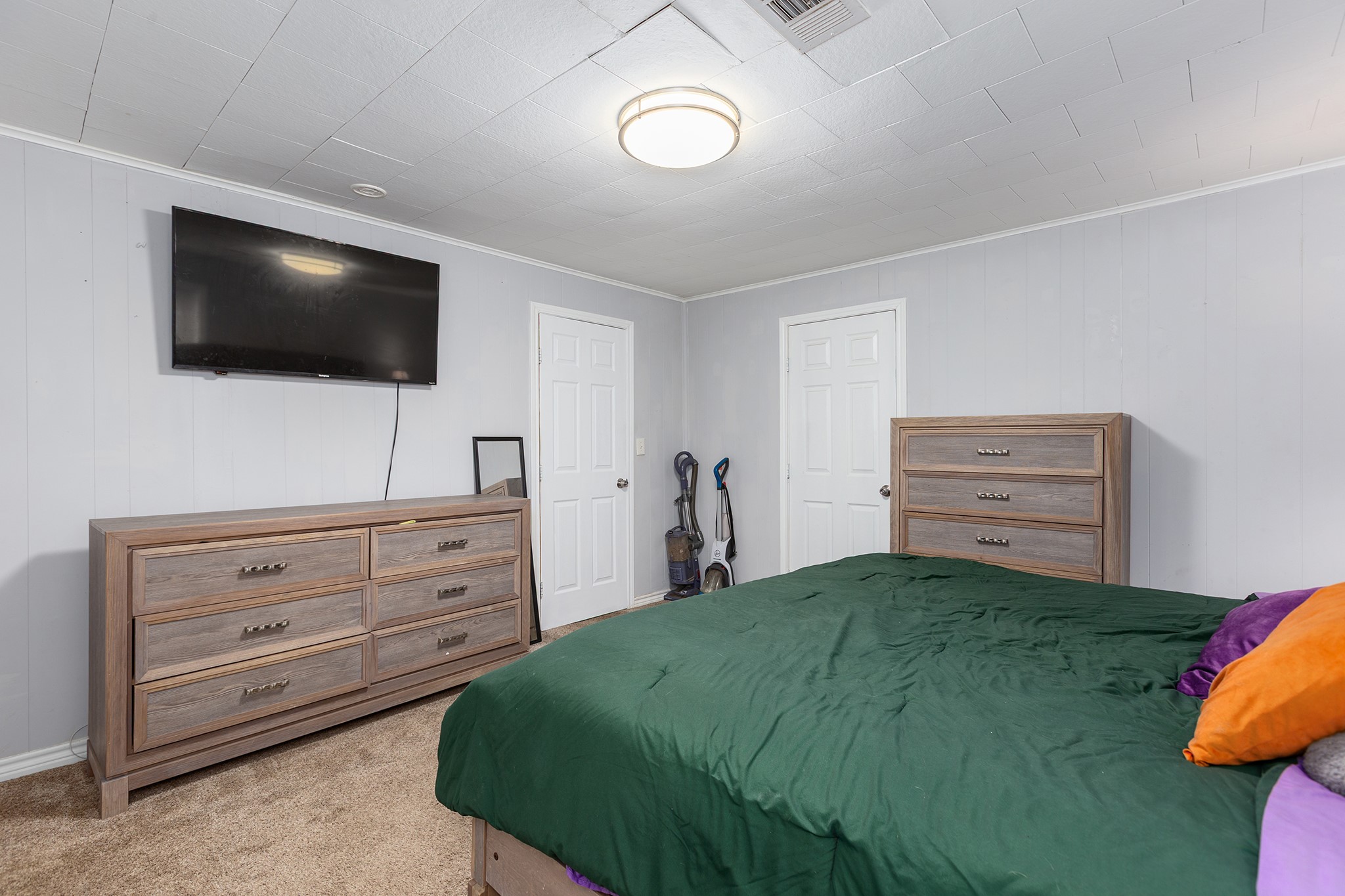 240 North 7th Street Trinity, TX 75862 - Photo 24 of 32 a bedroom with a bed and a flat screen tv