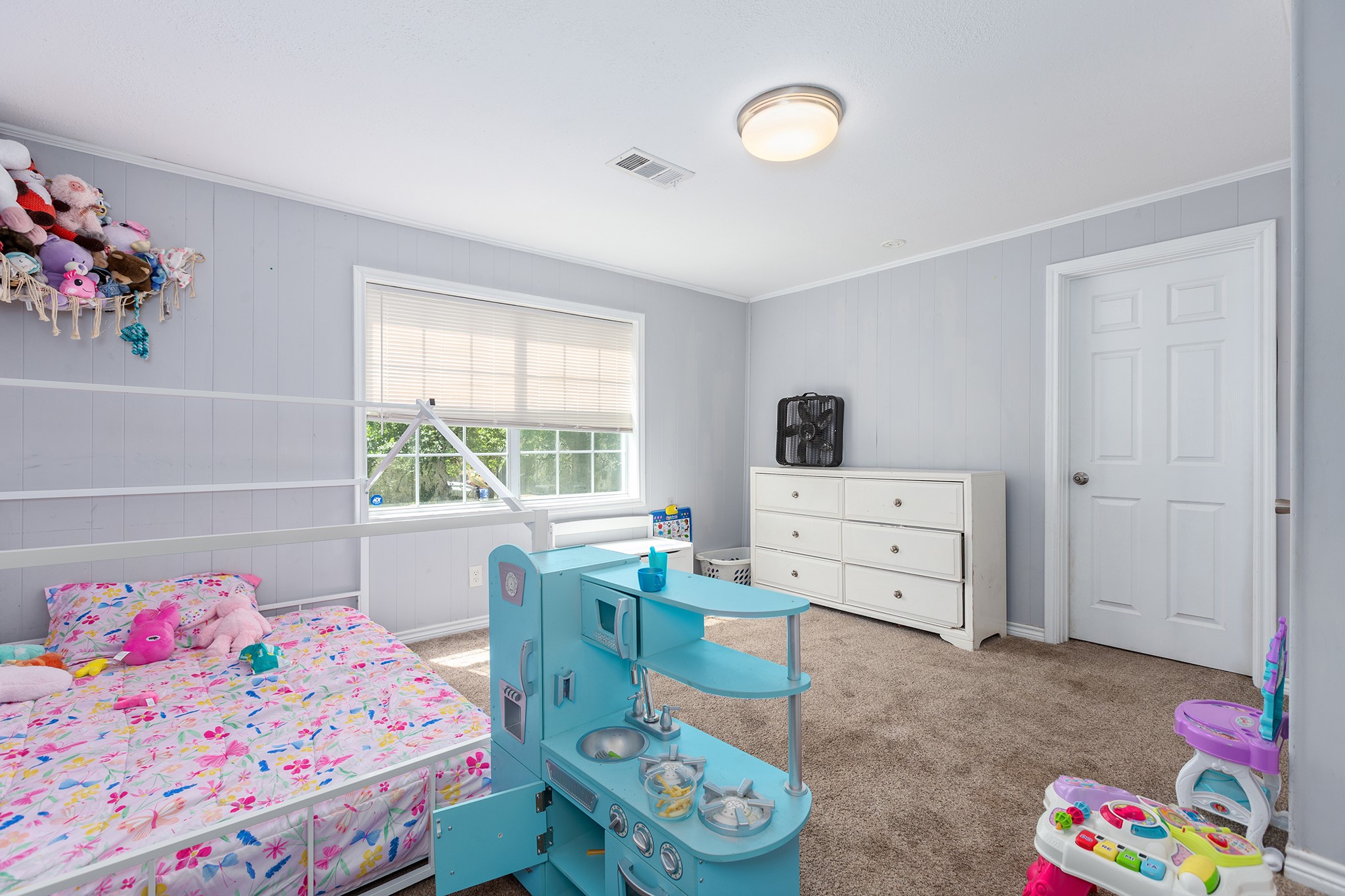240 North 7th Street Trinity, TX 75862 - Photo 28 of 32 a bedroom with a bed and a window