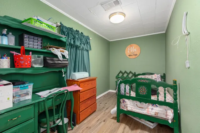 a room with lots of wooden furniture and a fireplace