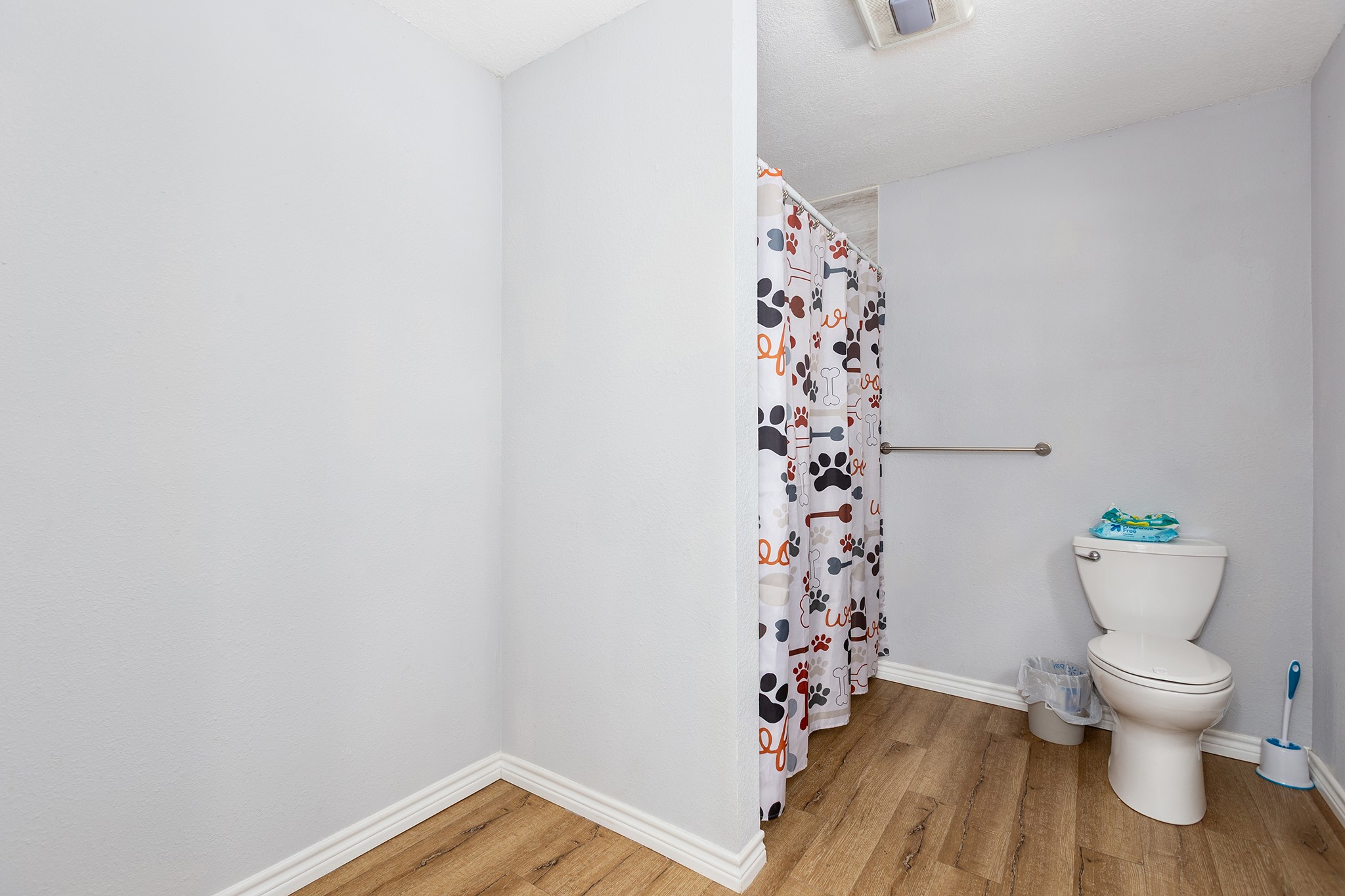 240 North 7th Street Trinity, TX 75862 - Photo 32 of 32 a bathroom with a toilet and a shower curtain