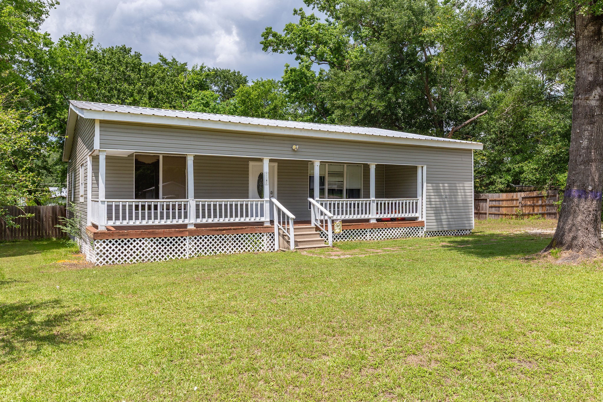 240 North 7th Street Trinity, TX 75862 - Photo 5 of 32 a house view with a garden space