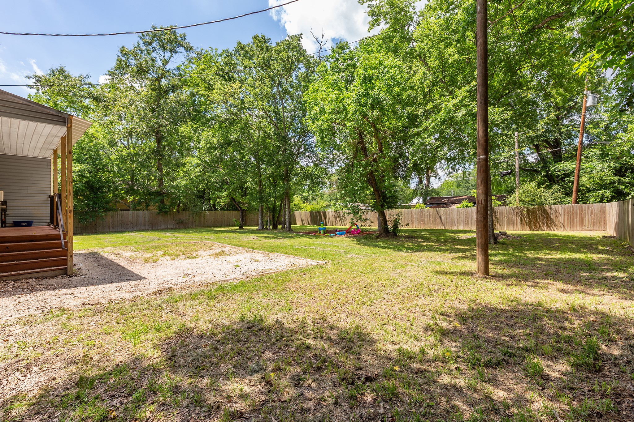 240 North 7th Street Trinity, TX 75862 - Photo 7 of 32 a view of yard with tree
