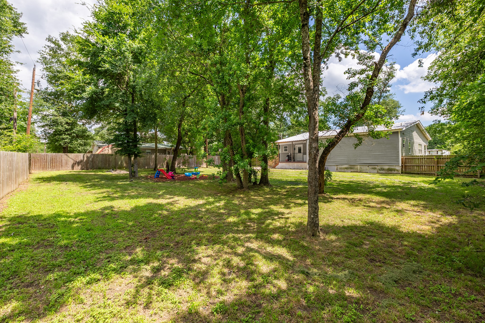240 North 7th Street Trinity, TX 75862 - Photo 10 of 32 a view of a tree in a yard