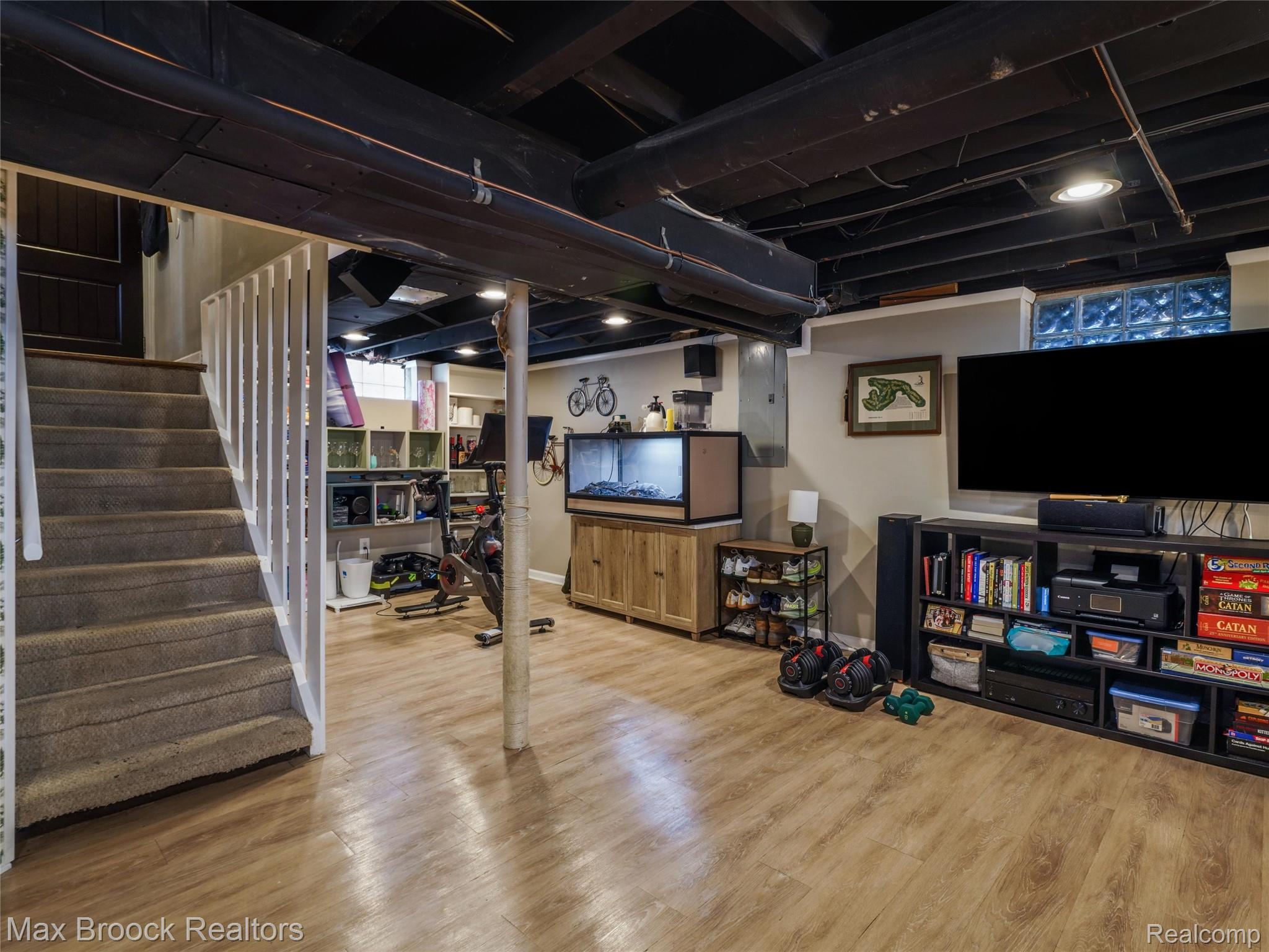 1201 Cole Street Birmingham, MI 48009 - Photo 25 of 35 Finished basement area featuring wood-finish flooring and recessed ceiling lighting