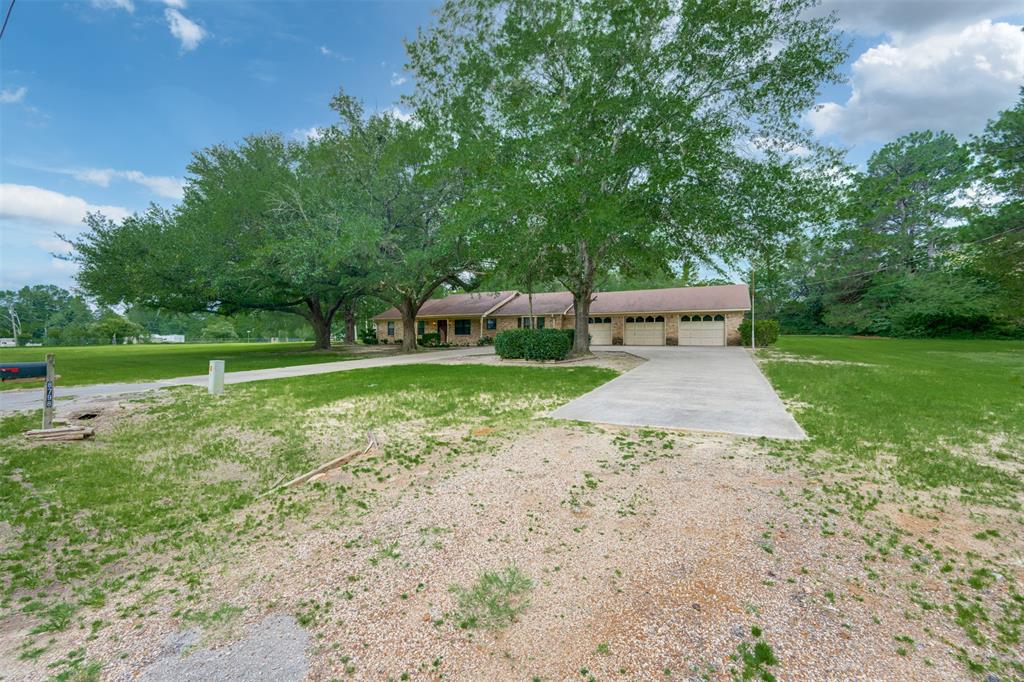 8798 Hill N Dale Road Tyler, TX 75709 - Photo 3 of 31 Ranch-style residence featuring a brick exterior and a three-car garage