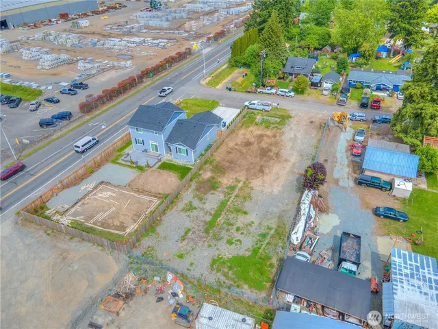 an aerial view of a house with a yard