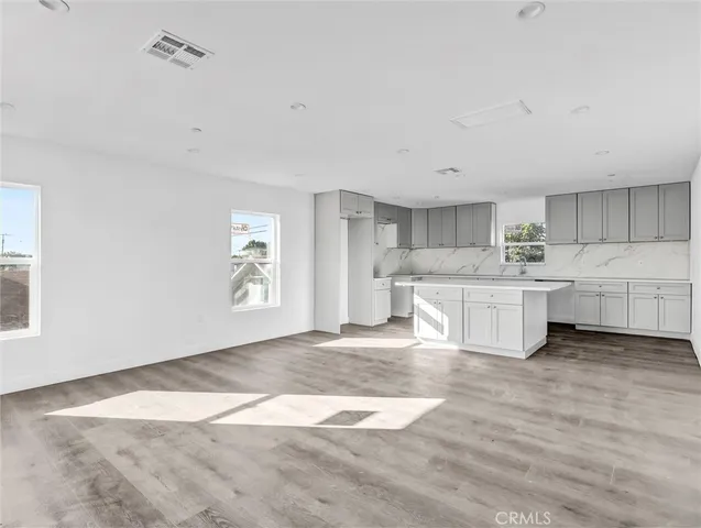 a view of kitchen with wooden floor