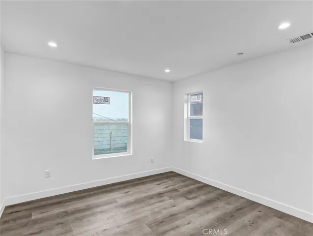 a view of a livingroom with wooden floor