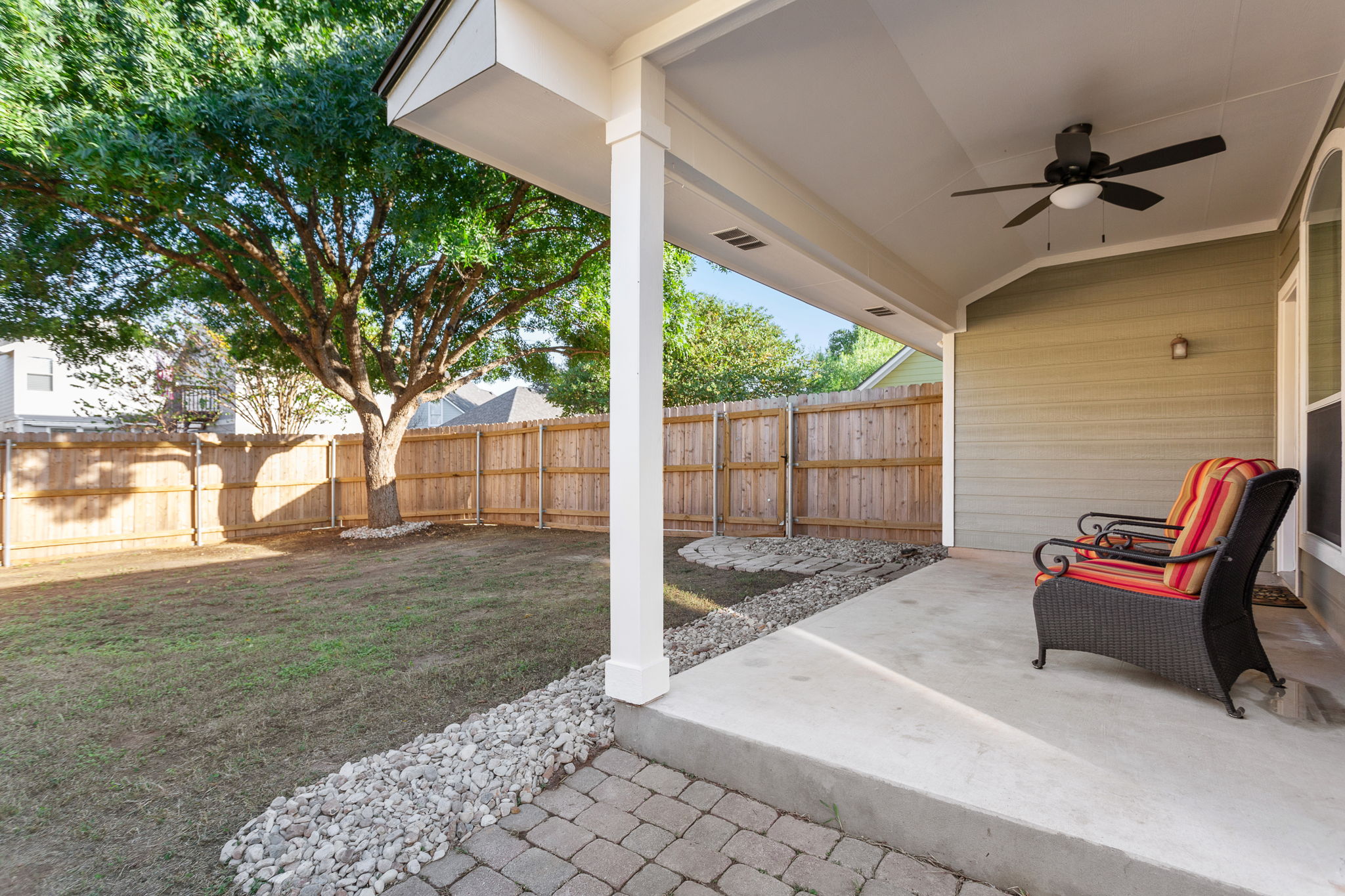 313 Greenside Lane Georgetown, TX 78633 - Photo 12 of 40 Fenced backyard featuring a patio and ceiling fan