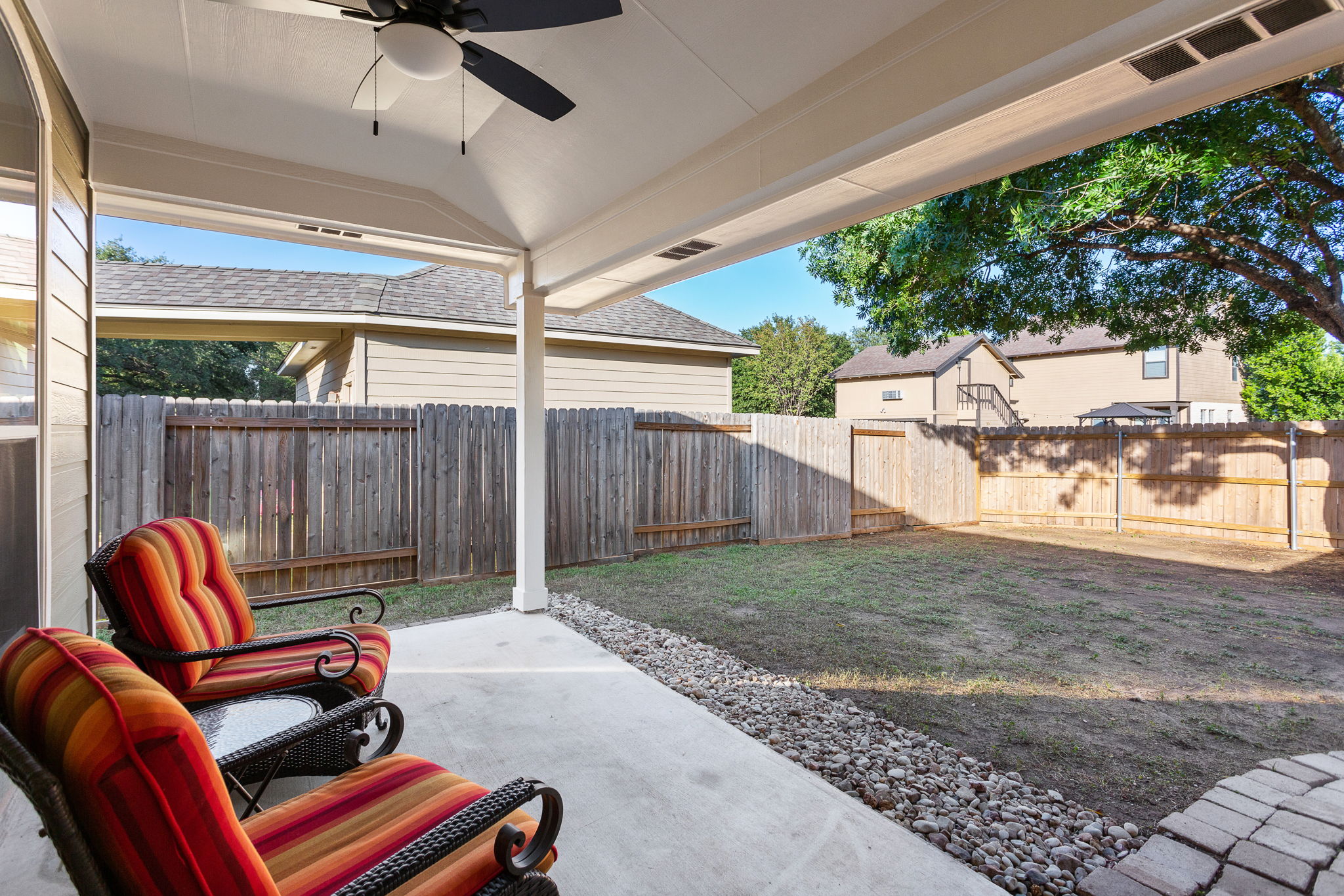 313 Greenside Lane Georgetown, TX 78633 - Photo 15 of 40 Fenced backyard featuring ceiling fan and a patio area
