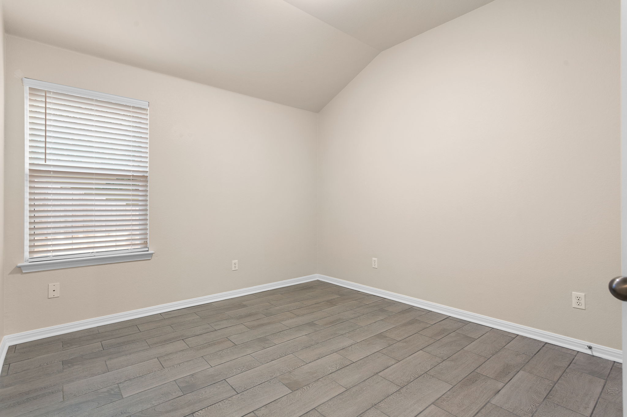 313 Greenside Lane Georgetown, TX 78633 - Photo 29 of 40 Spare room featuring vaulted ceiling and wood tiled floors