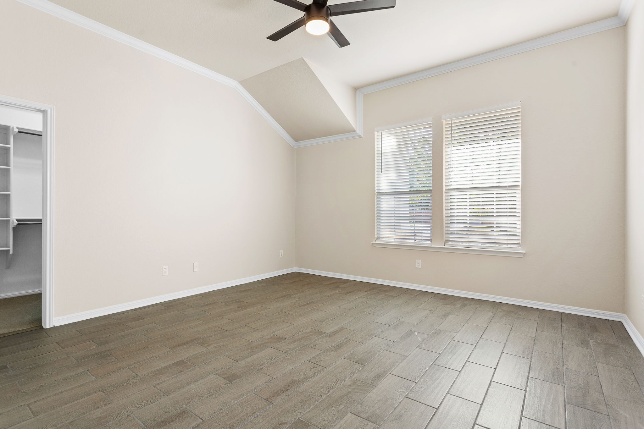 313 Greenside Lane Georgetown, TX 78633 - Photo 32 of 40 Additional living space with ceiling fan, lofted ceiling, and wood finish floors