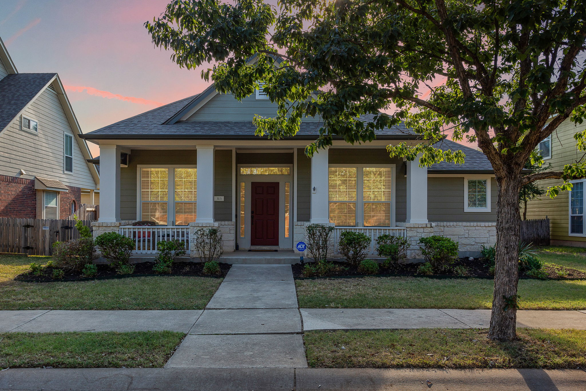 313 Greenside Lane Georgetown, TX 78633 - Photo 40 of 40 View of front of property featuring a porch, roof with shingles, and stone siding
