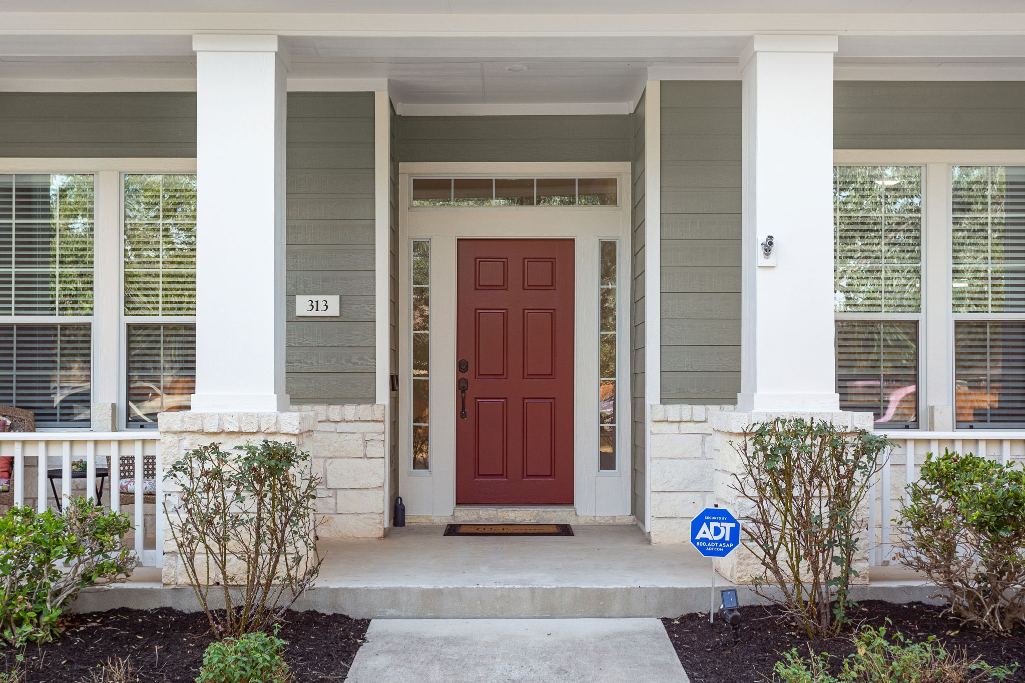 313 Greenside Lane Georgetown, TX 78633 - Photo 4 of 40 Property entrance with stone siding and a porch