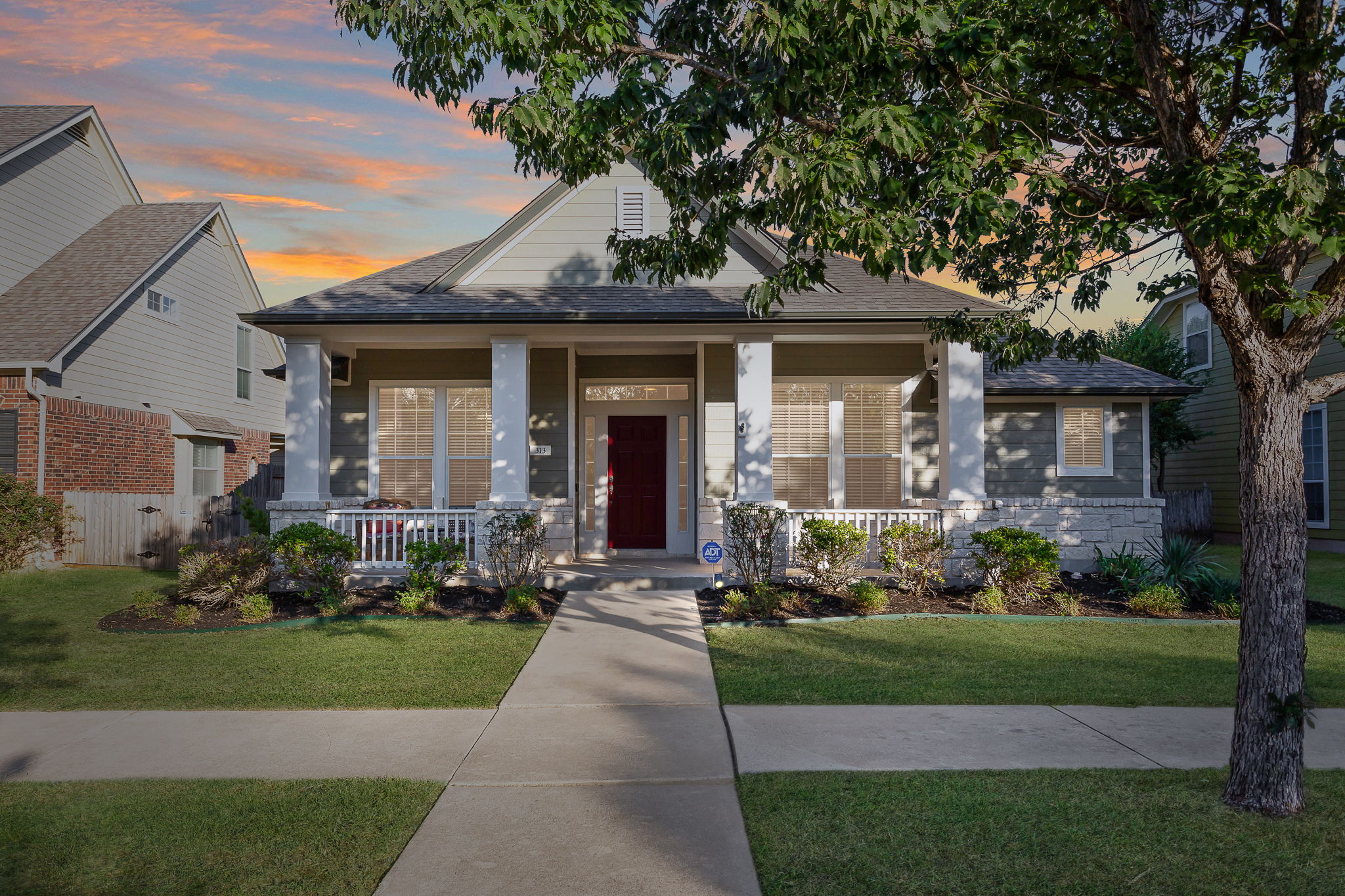 313 Greenside Lane Georgetown, TX 78633 - Photo 9 of 40 View of front of house with a porch, a front yard, and roof with shingles