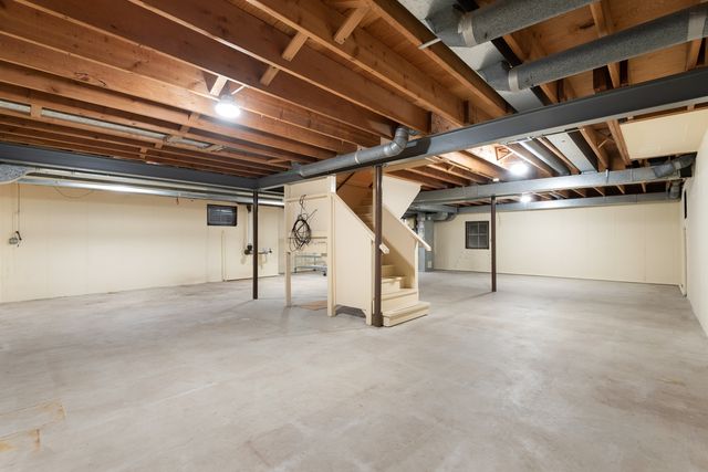 a view of a patio with table and chairs and potted plants