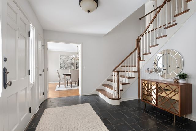 a view of an entryway with wooden floor