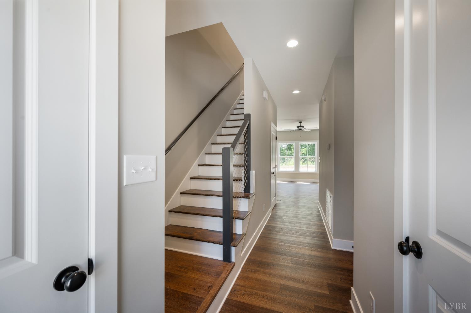61 Luke Court Rustburg, VA 24588 - Photo 5 of 39 a view of a hallway with wooden floor and staircase