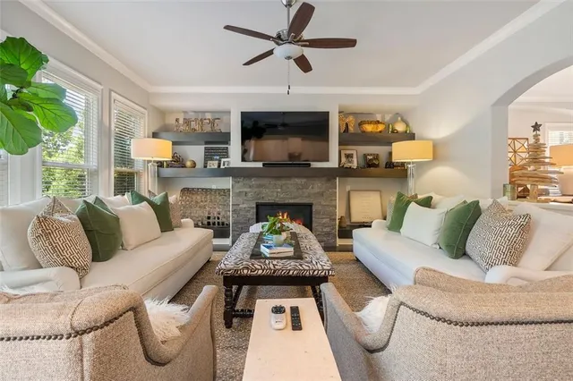 a living room with furniture and a fireplace