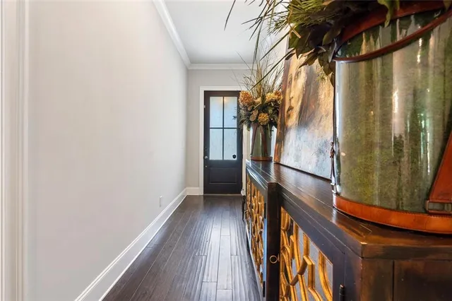 a view of walk in closet with wooden floor