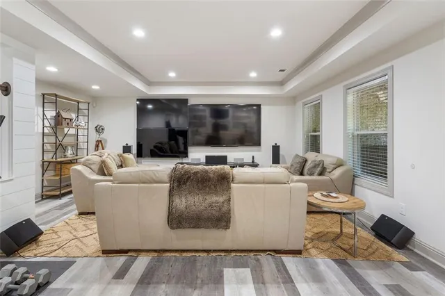 a bathroom with a granite countertop sink toilet a large mirror a shower and vanity
