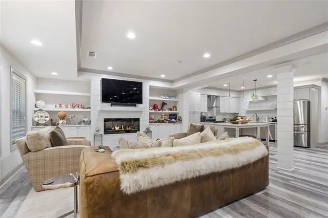 a kitchen with counter top space a sink cabinets and stainless steel appliances