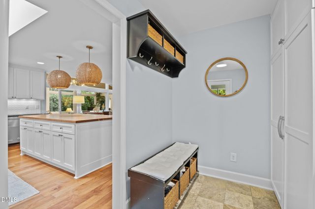 a wooden bench sitting in front of a building