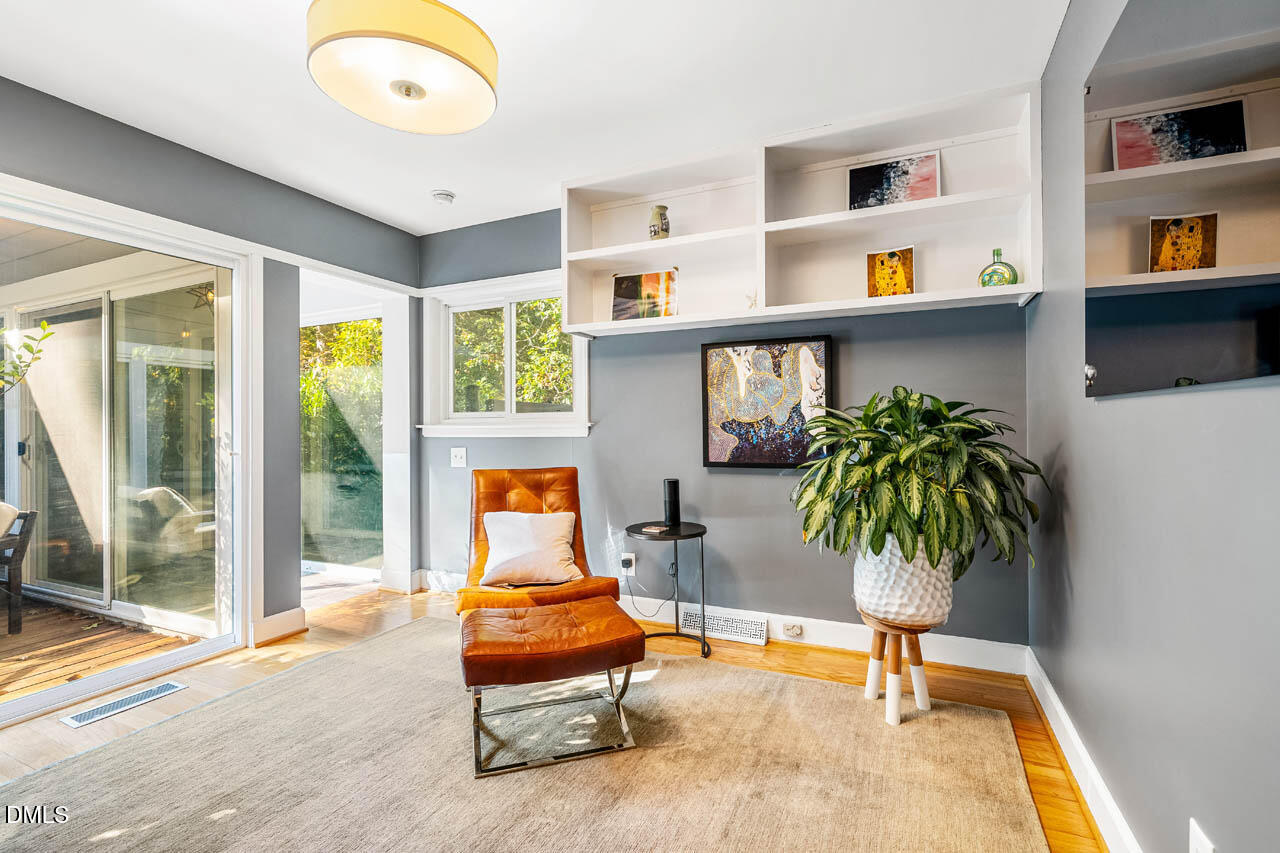 1812 Rolling Road Chapel Hill, NC 27514 - Photo 25 of 72 a living room with furniture lamp and potted plant